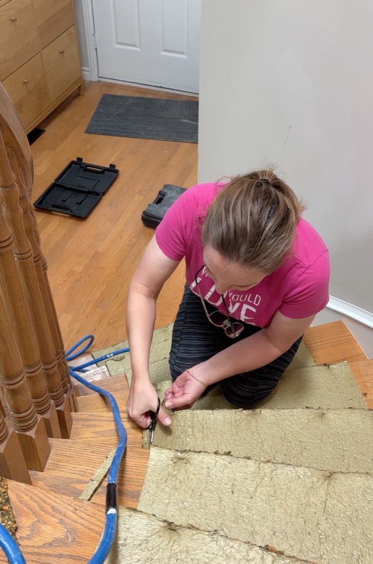 Pulling up old carpet from a staircase